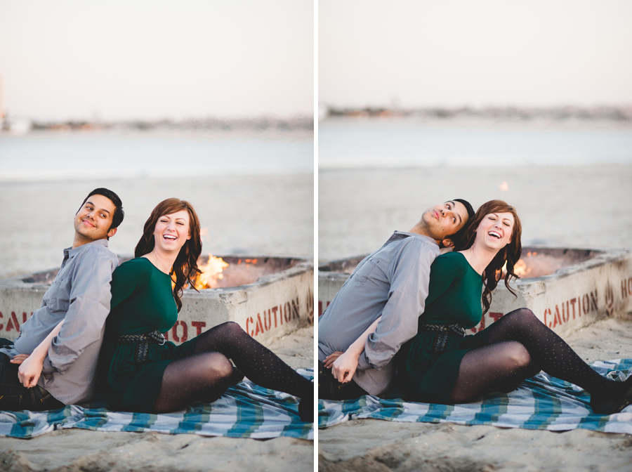 newly engaged couple laughing in front of a bonfire, creative denver engagement photographer