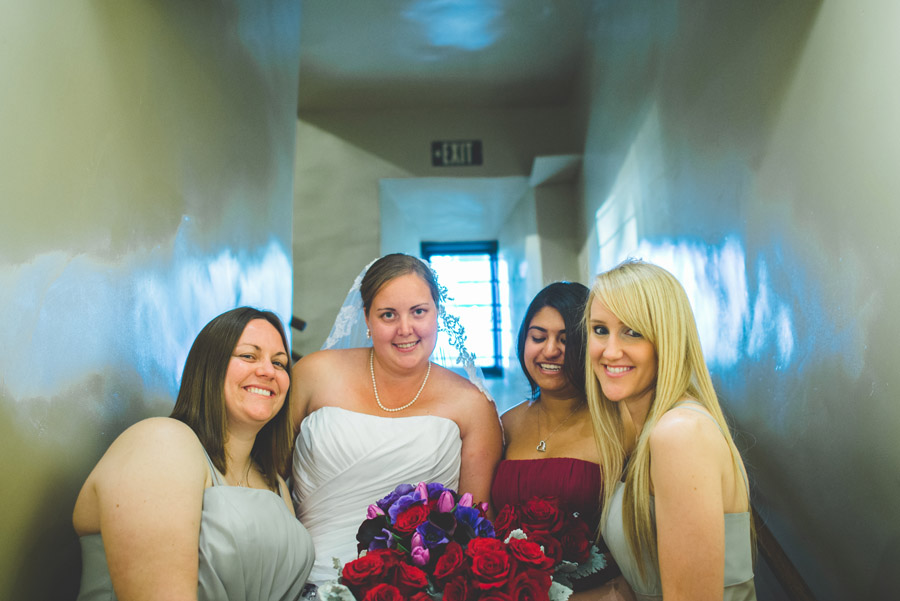 bridal party laughing in the saint francis chapel in Balboa Park