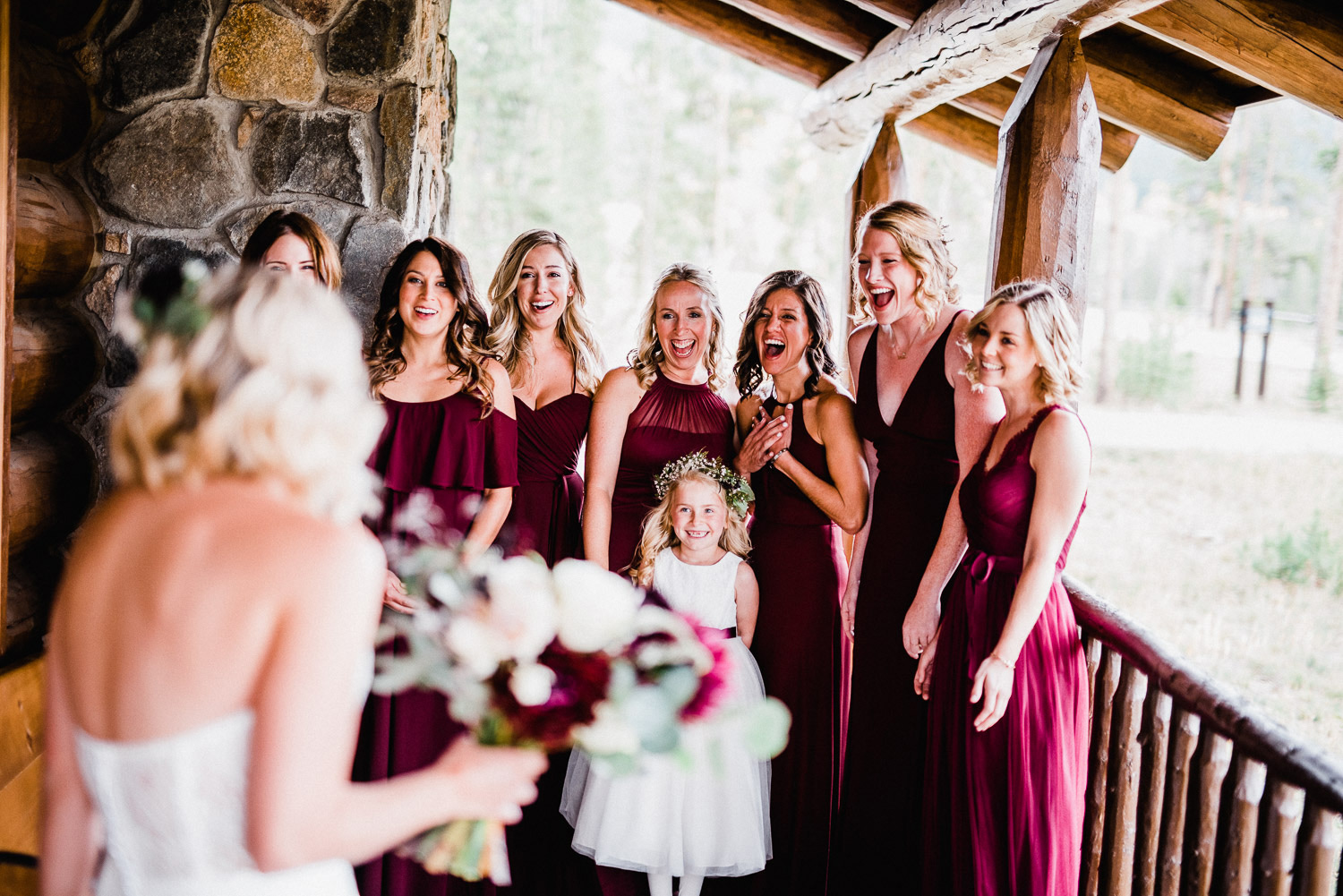 bridesmaids seeing bride in wedding dress for the first time at devil's thumb ranch